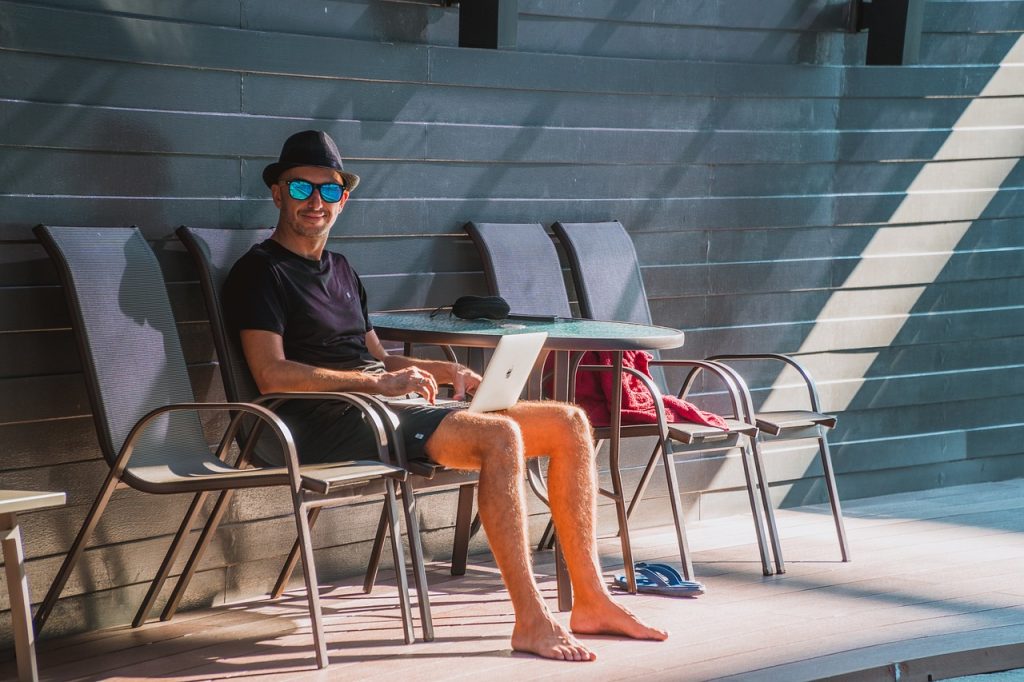 Digital Nomad Working at the Swimming Pool